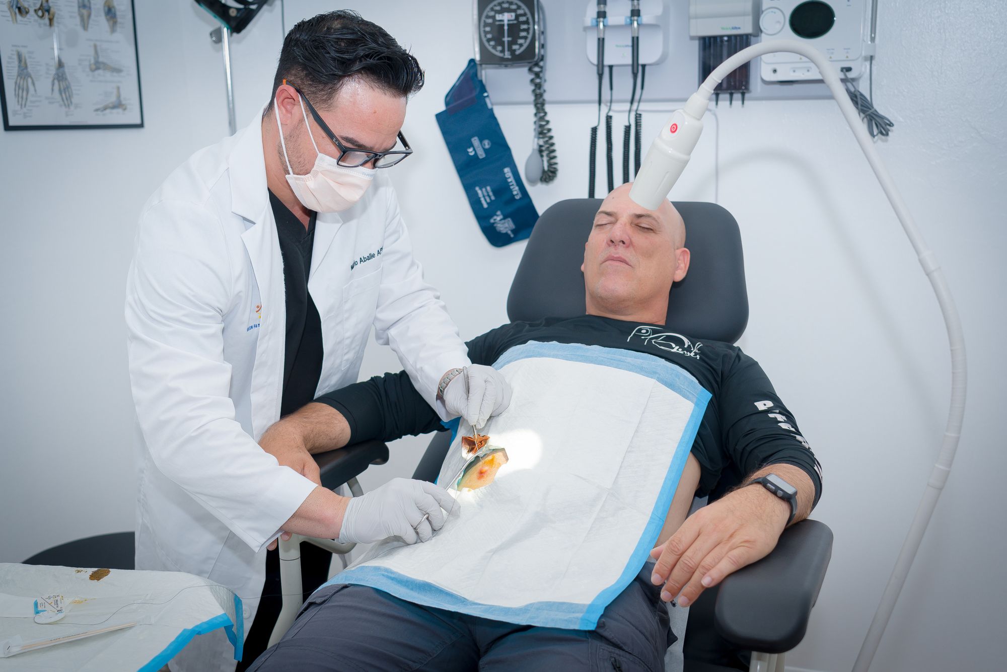 Mario Aballe, FNP performing a minor in-office procedure
